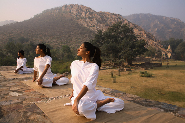 Women Practicing Yoga at Bhangarh